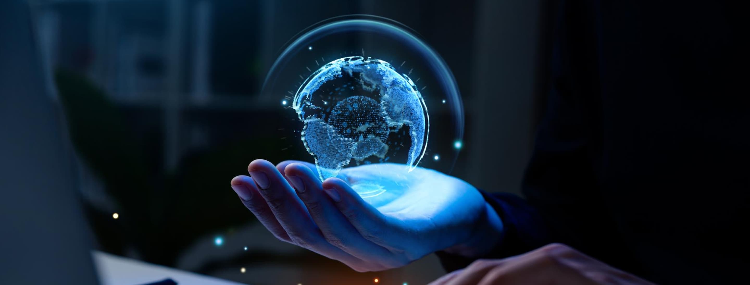 A globe held aloft in a hand.